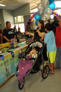Parents and prospective students check Elsie Allen High School's booth at the district showcase Sept. 27. 